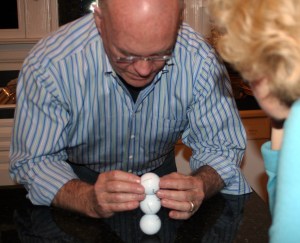 Tony, Stacking 3 golf balls.